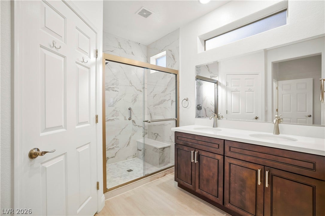 Owner's Bathroom with Raised Vanity, Dual Sinks, Shower w/ Seat, and Comfort Height Toilet w/ Bidet Heated Seat
