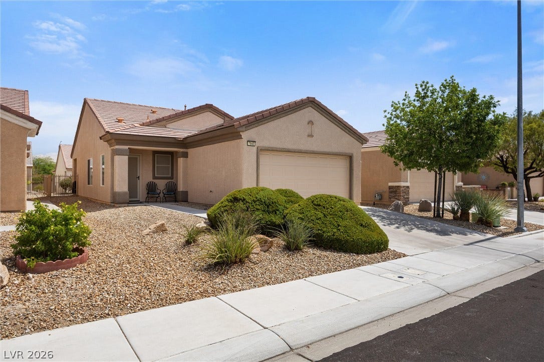 7940 Fantail Drive, North Las Vegas, NV 89084 Neat desert landscaping and a concrete driveway lead to this classic stucco exterior.