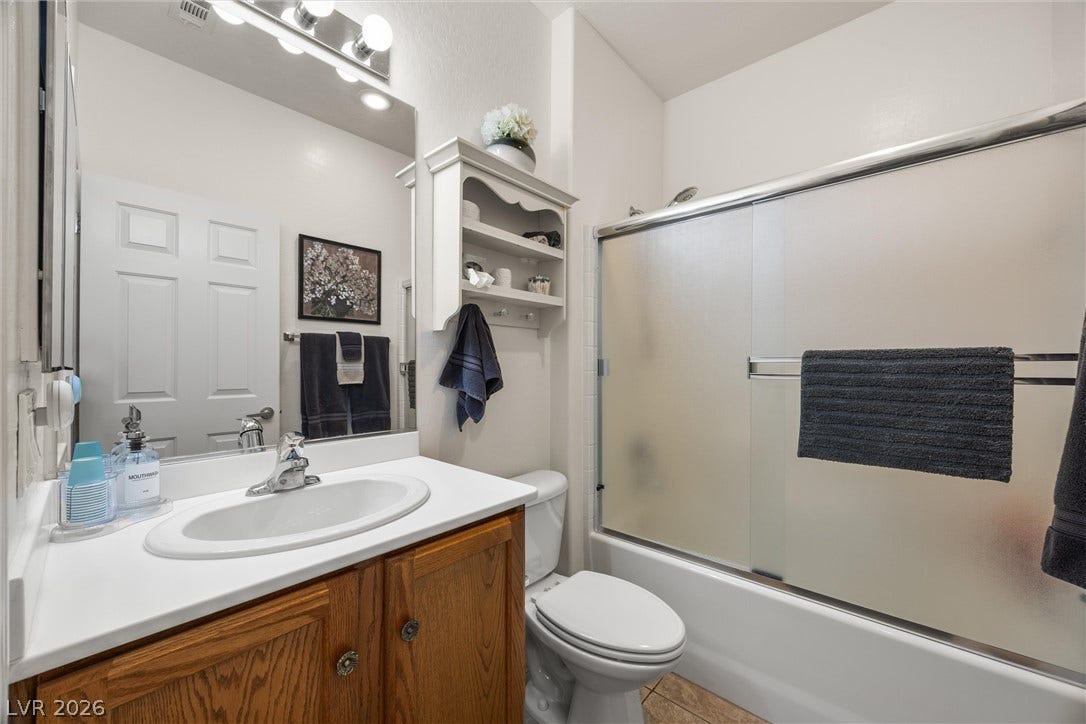 7940 Fantail Drive, North Las Vegas, NV 89084 Functional layout maximizes utility with integrated storage and a classic tub shower combination.