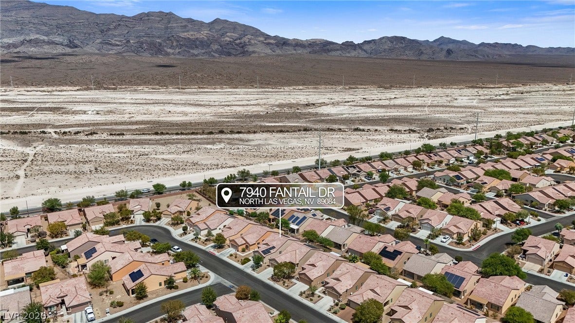 7940 Fantail Drive, North Las Vegas, NV 89084 Striking desert mountains rise majestically behind this orderly residential neighborhood.