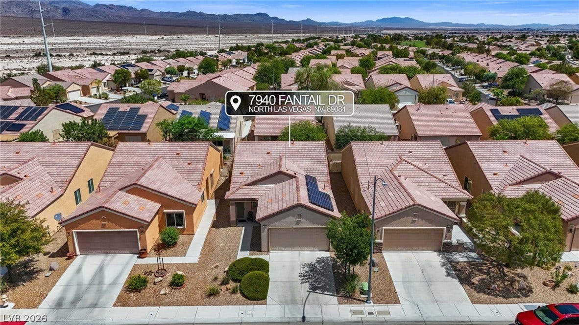 7940 Fantail Drive, North Las Vegas, NV 89084 Nestled in a quiet neighborhood, this home features classic tile roofing and a desert-landscaped front yard.