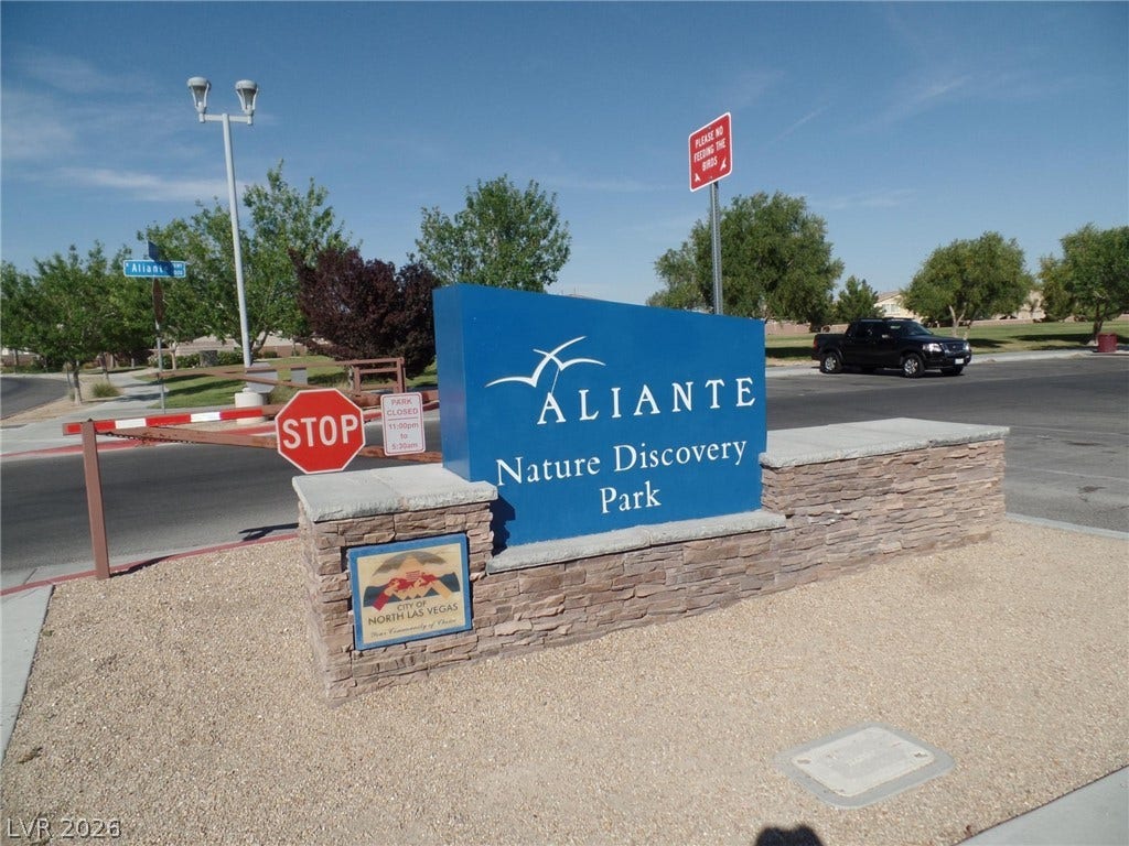 7940 Fantail Drive, North Las Vegas, NV 89084 An inviting stone and blue monument sign marks the entrance to a local neighborhood park.