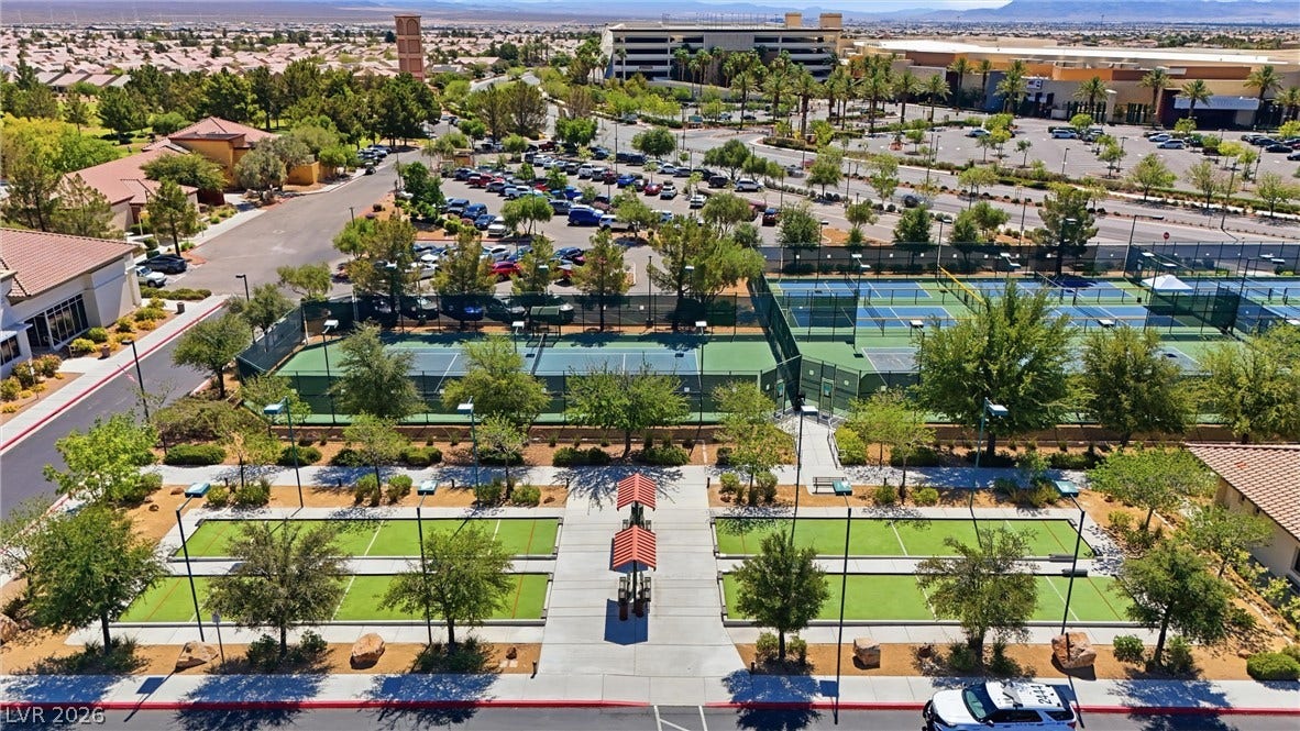 7940 Fantail Drive, North Las Vegas, NV 89084 Expansive community sports courts lie framed by manicured green spaces and pathways.