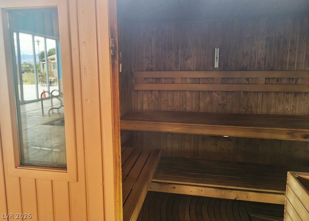 7940 Fantail Drive, North Las Vegas, NV 89084 Rich wood paneling and tiered bench seating define this relaxing private sauna.