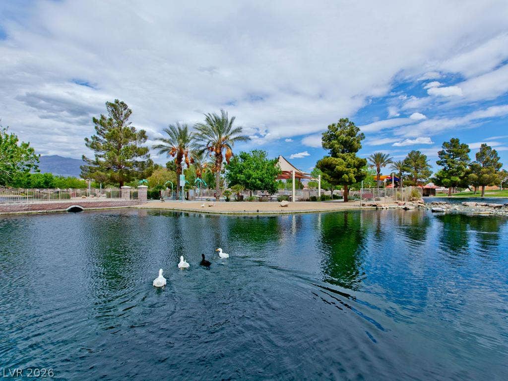 7940 Fantail Drive, North Las Vegas, NV 89084 Tranquil waters mirror the surrounding parkland under an expansive sky.