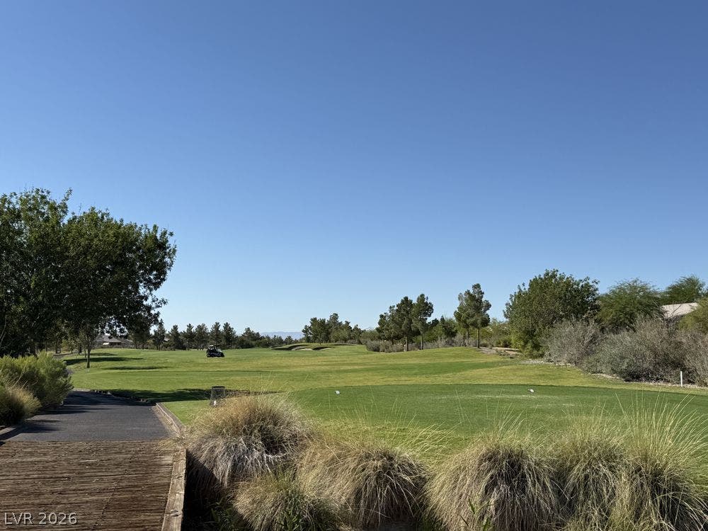 7940 Fantail Drive, North Las Vegas, NV 89084 Lush manicured fairways stretch beneath wide blue skies on this championship golf course.