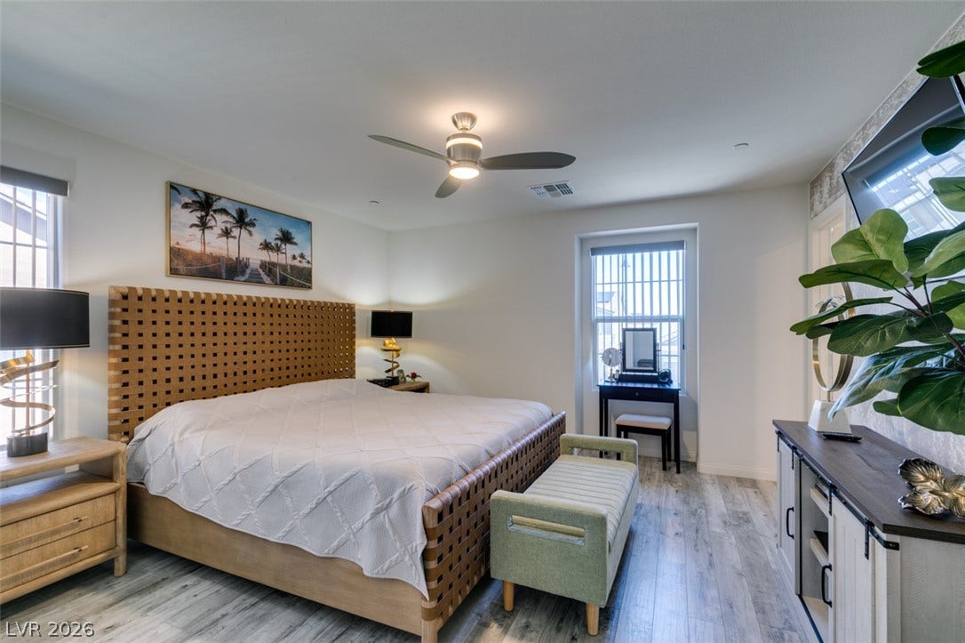3231 Pergusa Drive, Henderson, NV 89044 Gleaming wood floors and a clean layout define this tranquil sleeping space.