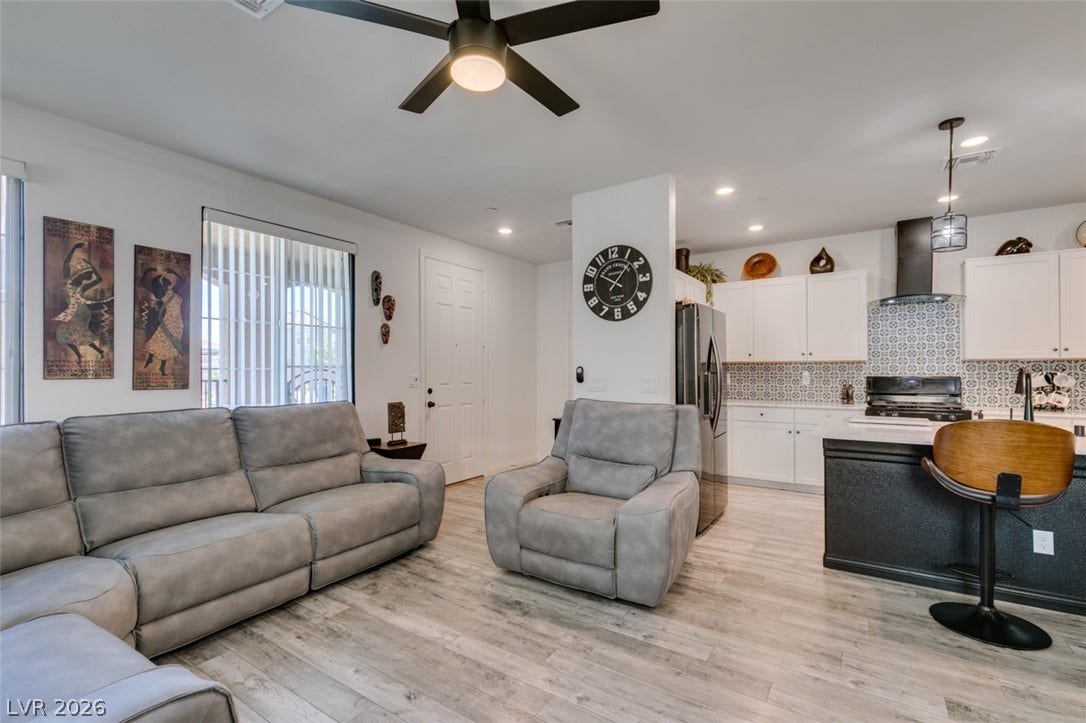 3231 Pergusa Drive, Henderson, NV 89044 An open concept floorplan seamlessly connects the comfortable living space to the modern kitchen.