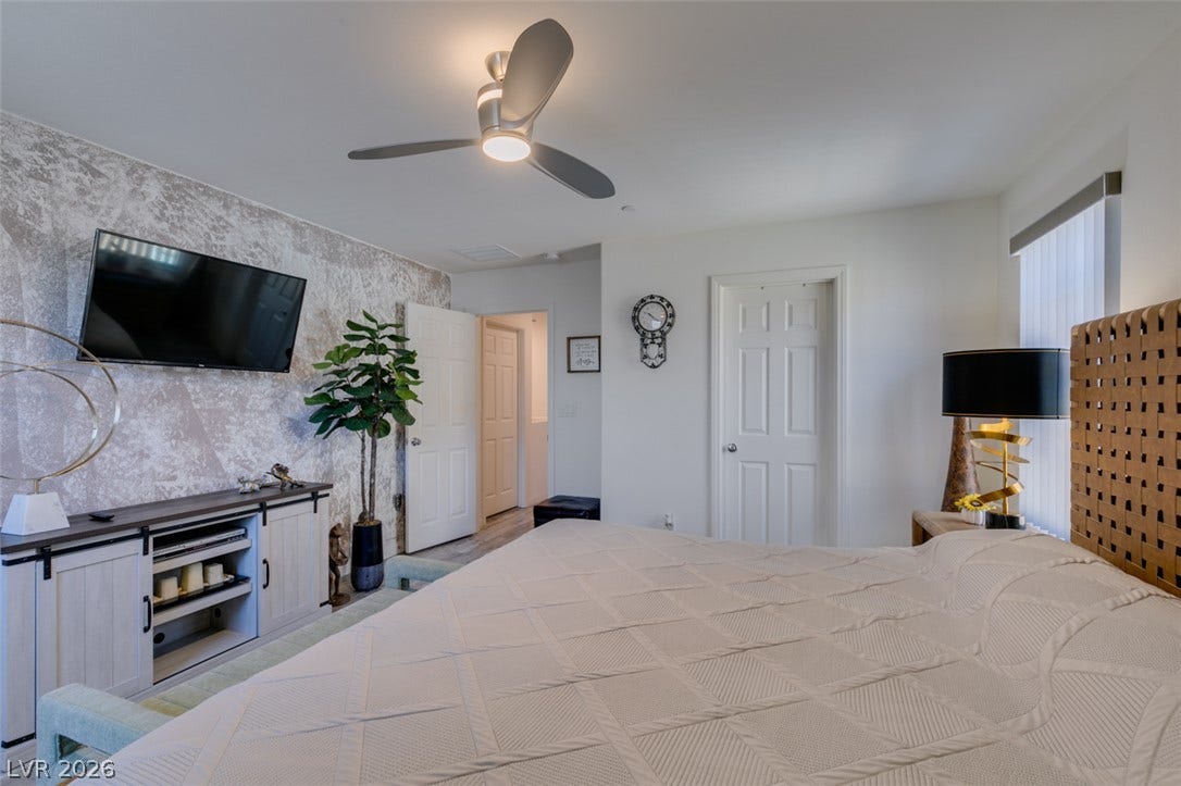3231 Pergusa Drive, Henderson, NV 89044 High ceilings and clean architectural lines define this welcoming bedroom space.