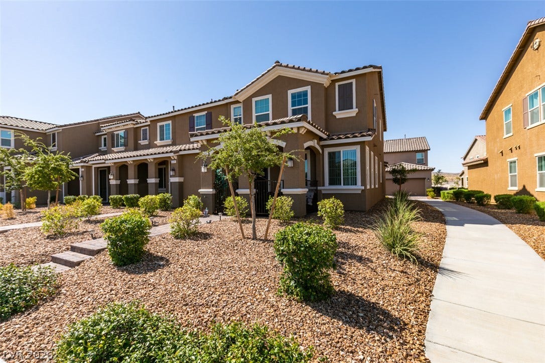 3231 Pergusa Drive, Henderson, NV 89044 Neat desert landscaping and paved walkways lead to a handsome stucco exterior.