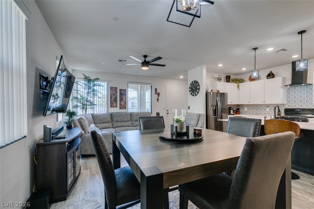 3231 Pergusa Drive, Henderson, NV 89044 An open concept layout seamlessly connects the dining area to the living space and kitchen.