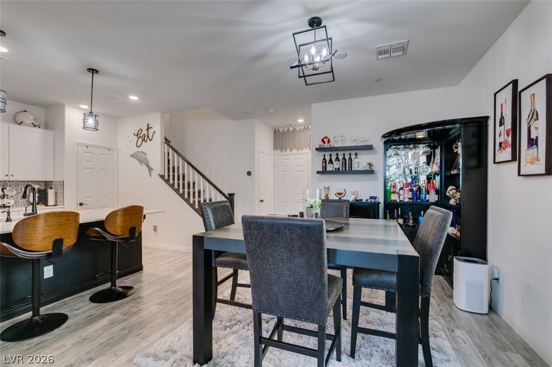 3231 Pergusa Drive, Henderson, NV 89044 Clean lines and light flooring define this open layout flowing from dining to kitchen.