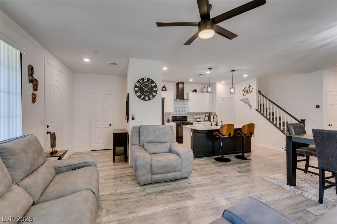 3231 Pergusa Drive, Henderson, NV 89044 An open floorplan seamlessly connects the airy living space to a modern kitchen.