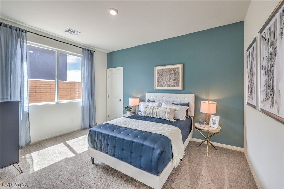 1036 PEACOCK PLUME Street, Henderson, NV 89011 Bedroom on the first floor. Photo is representational only; actual home finishes may vary. Bedroom on the first floor with carpet floors and baseboards