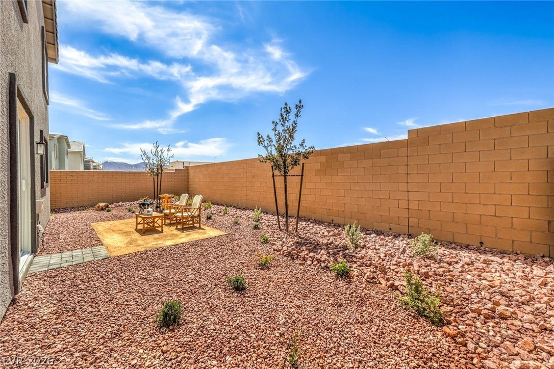 1036 PEACOCK PLUME Street, Henderson, NV 89011 Photo is representational only; actual home finishes may vary. Fenced backyard featuring a patio area