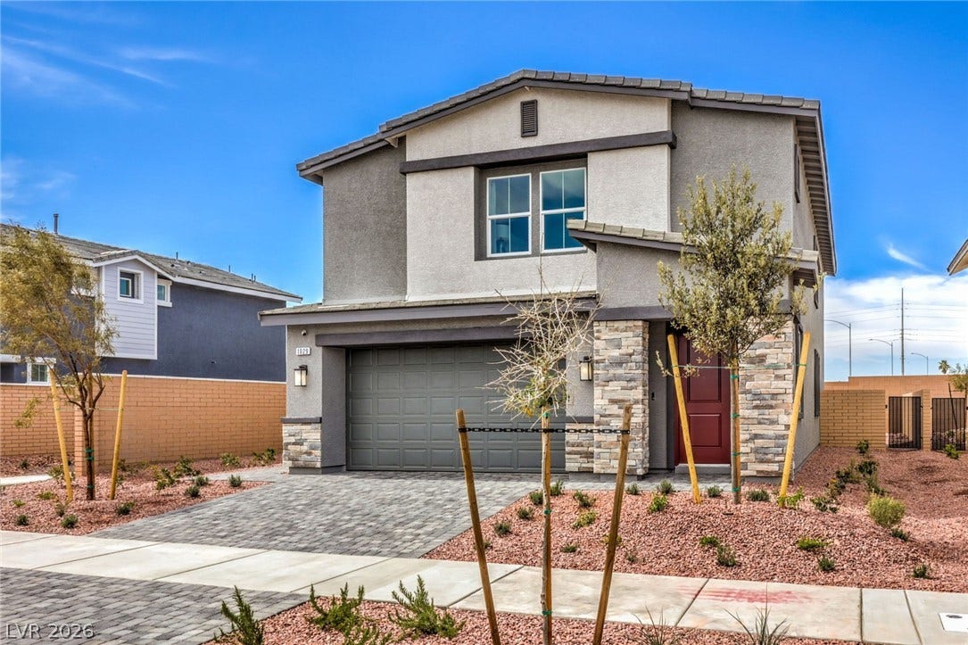 1036 PEACOCK PLUME Street, Henderson, NV 89011 Photo is representational only; actual home finishes may vary. View of front of home featuring stone siding, stucco siding, an attached garage, and decorative driveway