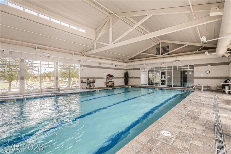 747 Orange Plume Walk, Henderson, NV 89011 Soaring vaulted ceilings and expansive windows frame this indoor lap pool.