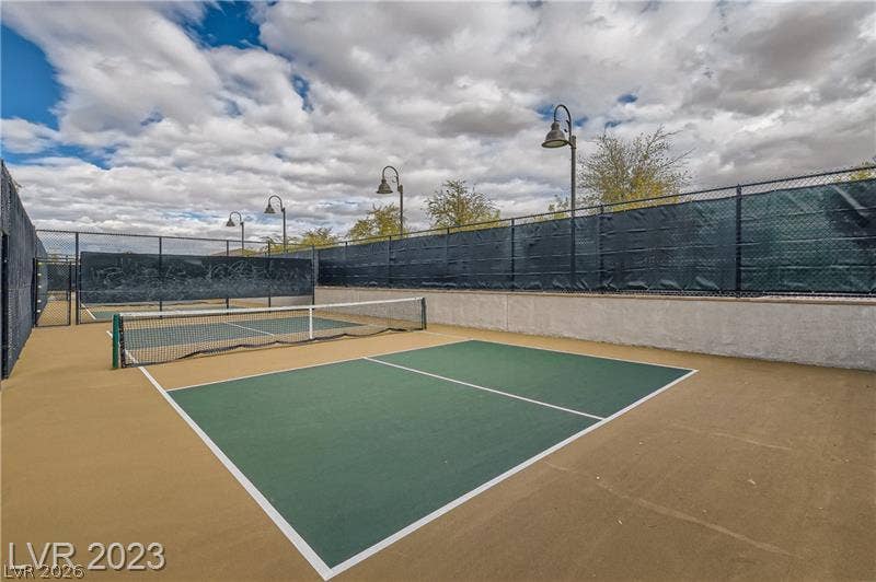 747 Orange Plume Walk, Henderson, NV 89011 Fenced courts provide outdoor recreation spaces under open skies.