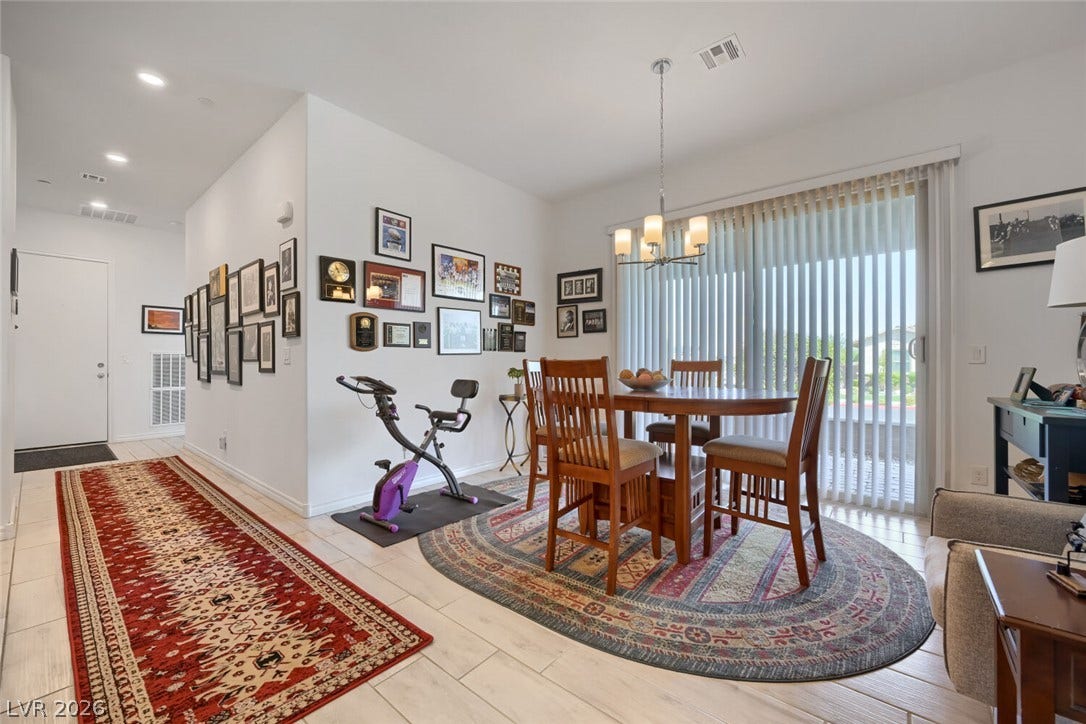 747 Orange Plume Walk, Henderson, NV 89011 Sliding glass doors open from the dining space directly to the outdoor patio.