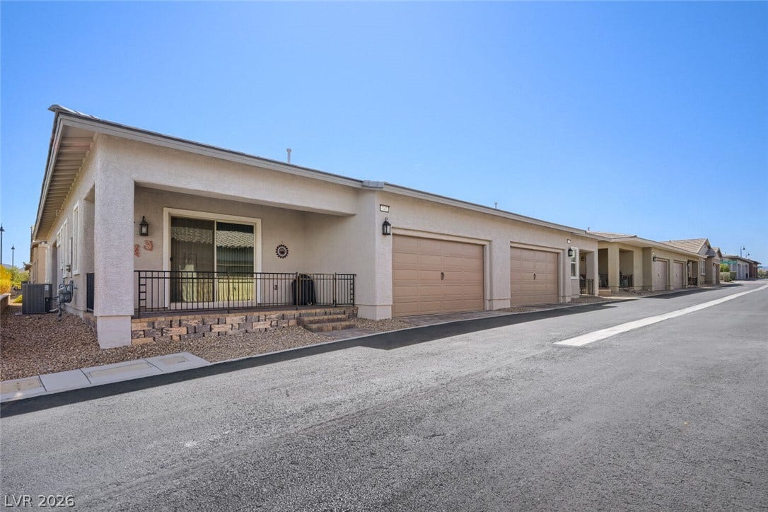 747 Orange Plume Walk, Henderson, NV 89011 Clean modern architectural lines define the exterior facade complete with multiple private garages.
