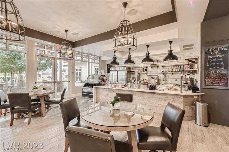 747 Orange Plume Walk, Henderson, NV 89011 Glass doors and light wood flooring define this inviting, open caf and dining space.