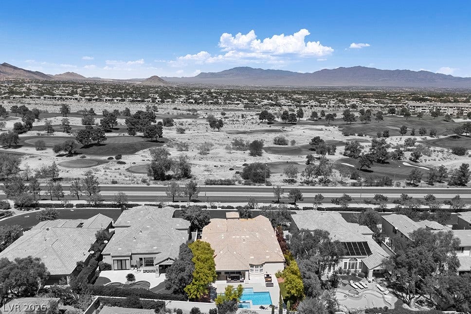 9425 Garnet Crown Avenue, Las Vegas, NV 89145 Majestic mountain ridges and a manicured golf course frame this exceptional desert estate.