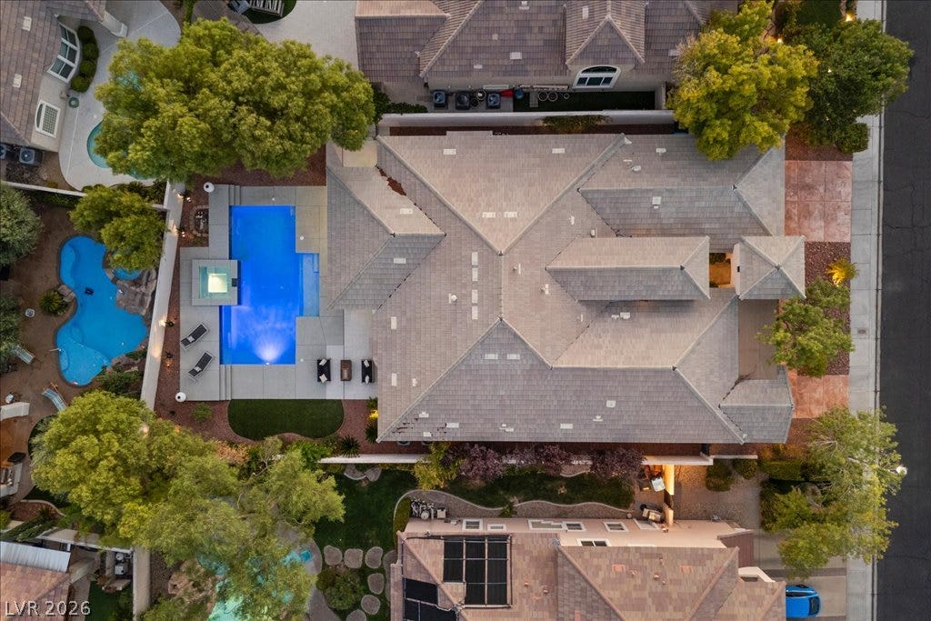 9425 Garnet Crown Avenue, Las Vegas, NV 89145 An aerial perspective showcases the beautifully tiled roofline and the inviting backyard swimming pool.