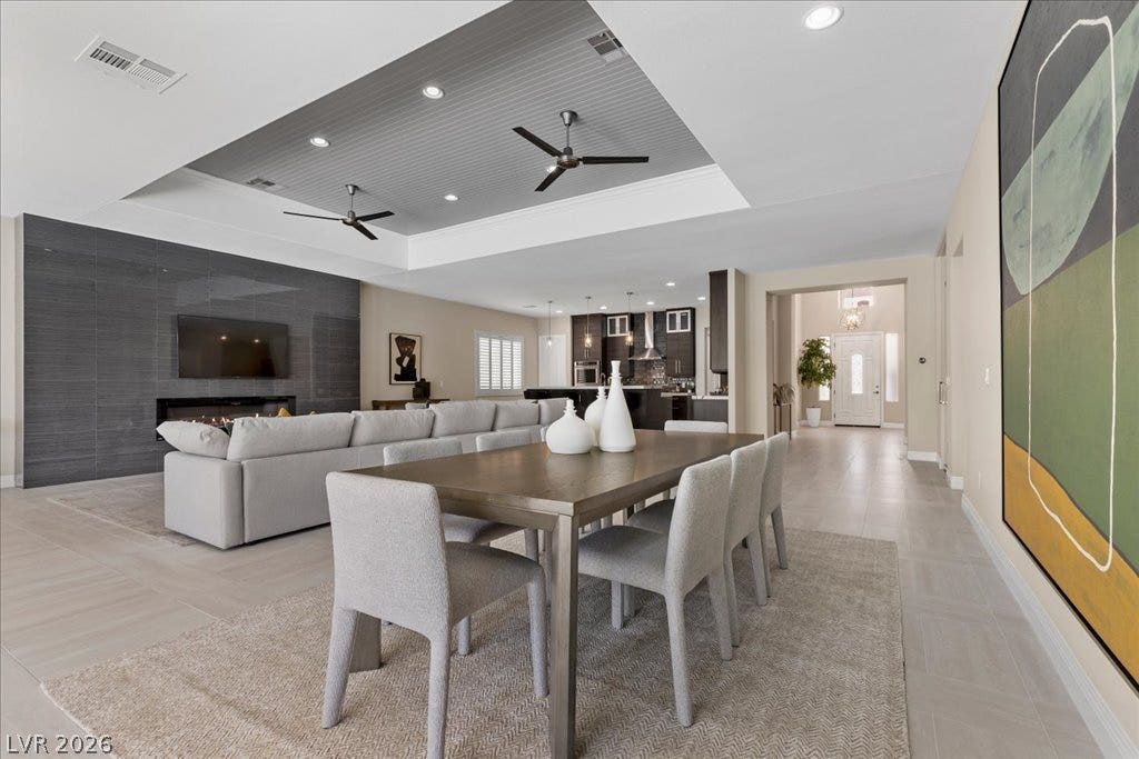 9425 Garnet Crown Avenue, Las Vegas, NV 89145 An open-concept dining and living space showcases an elegant recessed ceiling and tiled flooring.