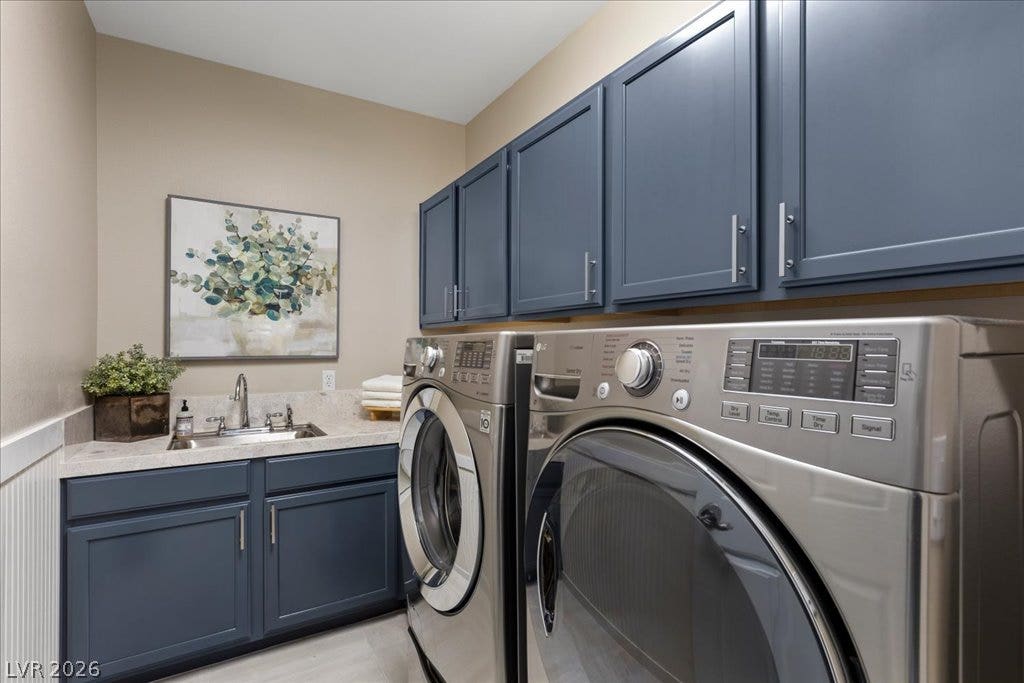 9425 Garnet Crown Avenue, Las Vegas, NV 89145 A functional workspace featuring built-in cabinetry, durable countertops, and an integrated utility sink.