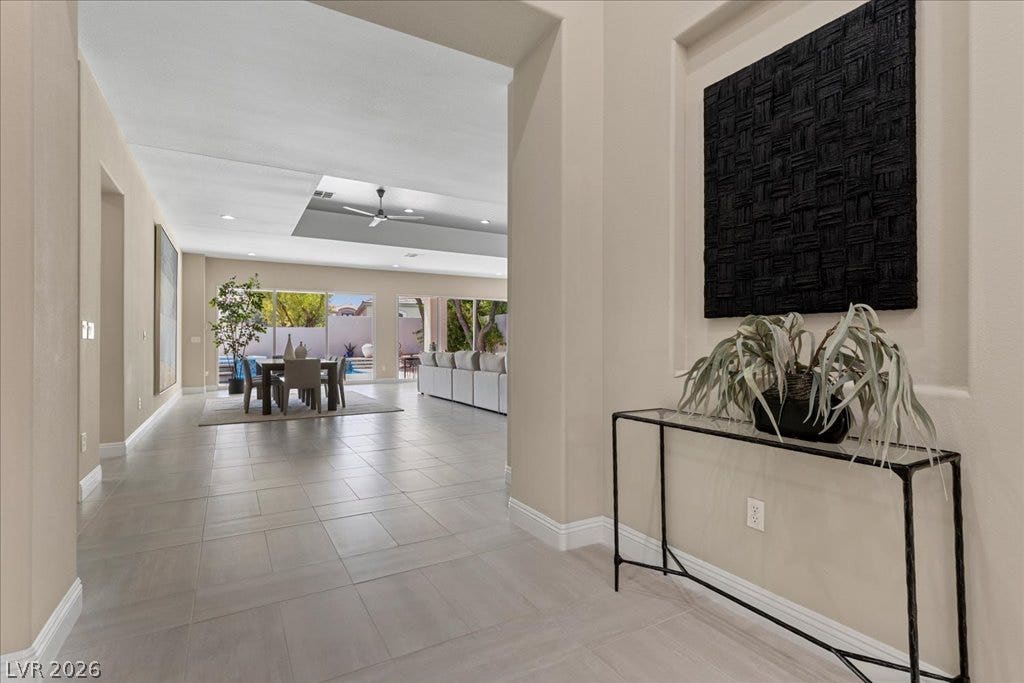9425 Garnet Crown Avenue, Las Vegas, NV 89145 An inviting entry hall flows into the open layout featuring large tile flooring throughout.