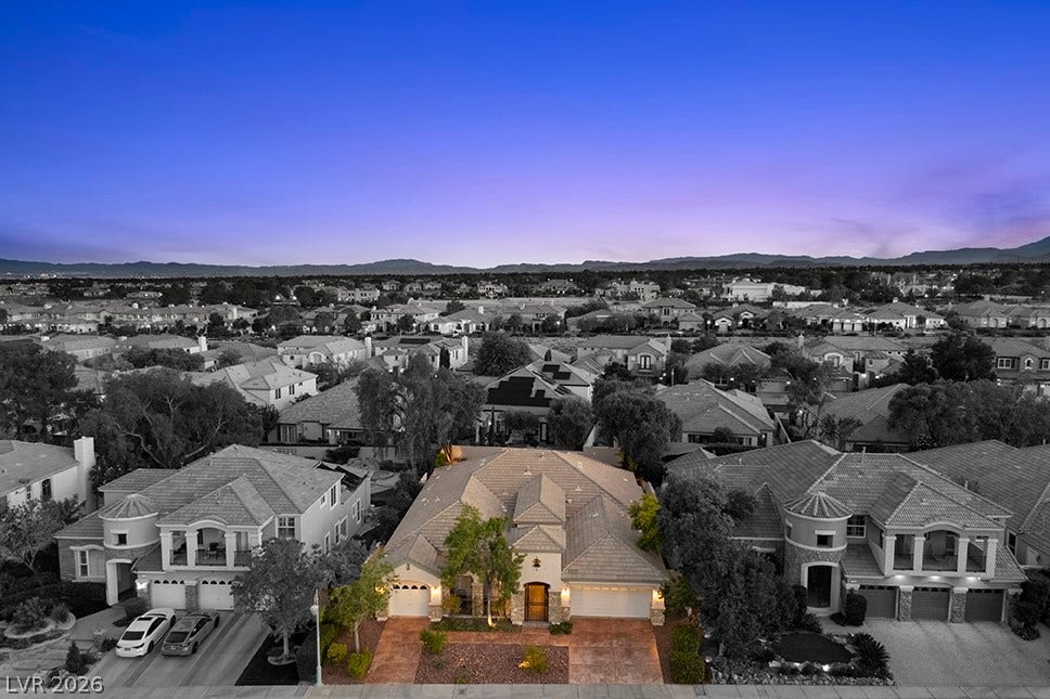 9425 Garnet Crown Avenue, Las Vegas, NV 89145 An elevated perspective captures this tile-roofed home nestled in a peaceful neighborhood setting.