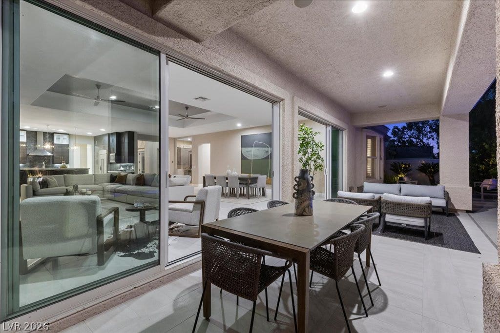 9425 Garnet Crown Avenue, Las Vegas, NV 89145 A spacious covered patio provides seamless transition to indoor living spaces through sliding glass doors.
