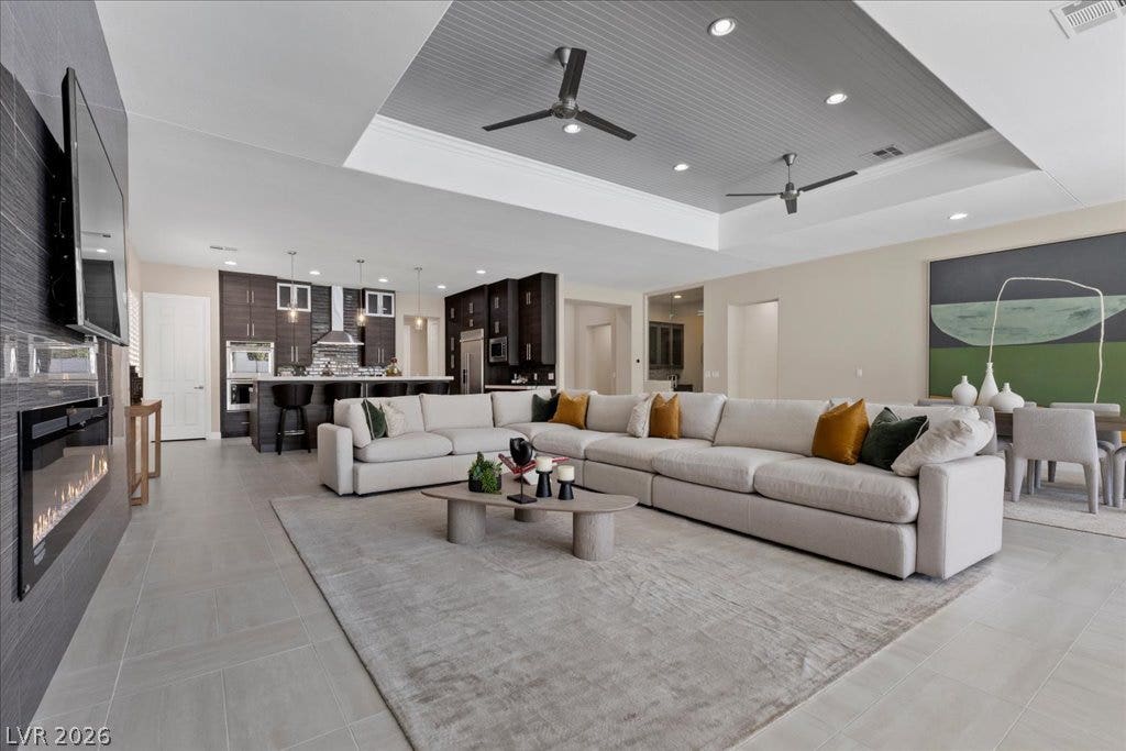 9425 Garnet Crown Avenue, Las Vegas, NV 89145 An open floorplan seamlessly connects the airy living area with the modern kitchen.