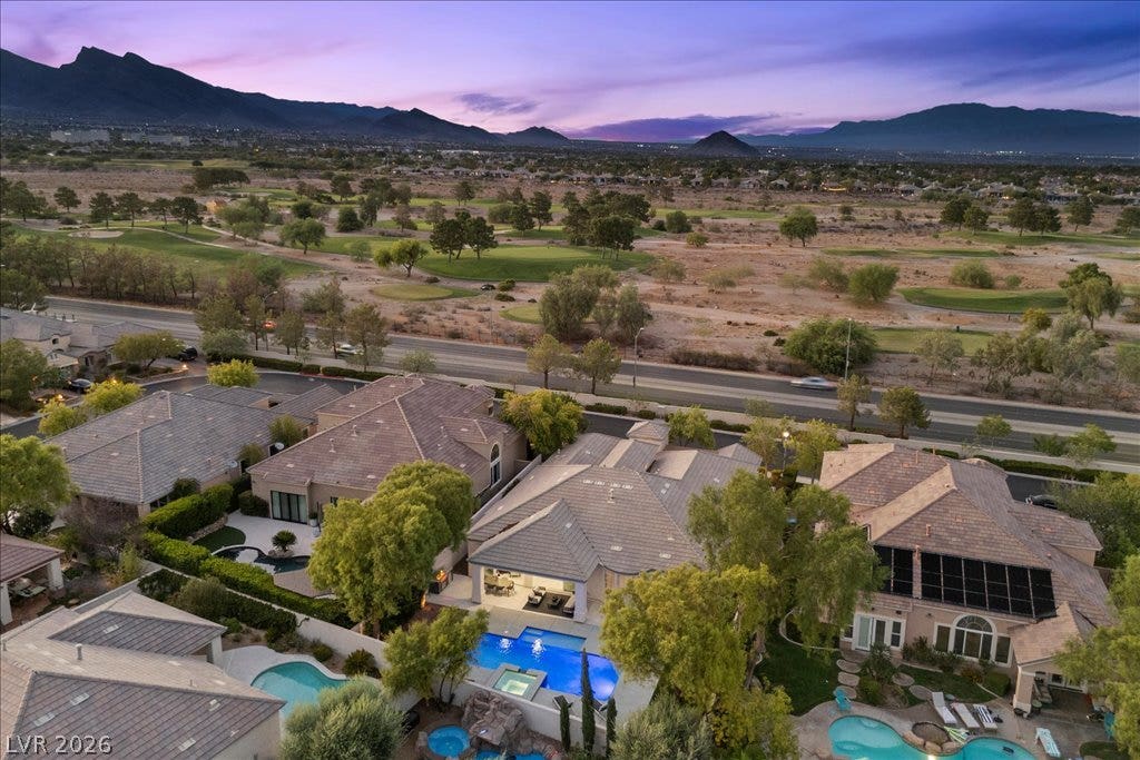 9425 Garnet Crown Avenue, Las Vegas, NV 89145 Sweeping mountain and desert views frame this exceptional property situated along a pristine golf course.