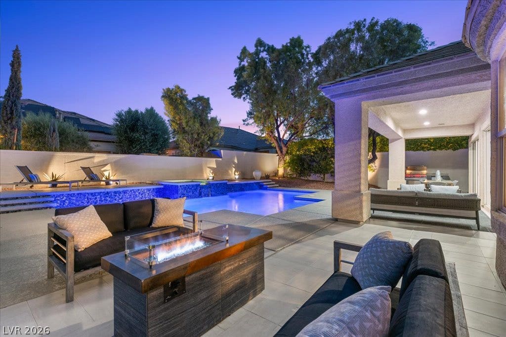 9425 Garnet Crown Avenue, Las Vegas, NV 89145 A sparkling swimming pool highlights this backyard oasis with a covered patio.
