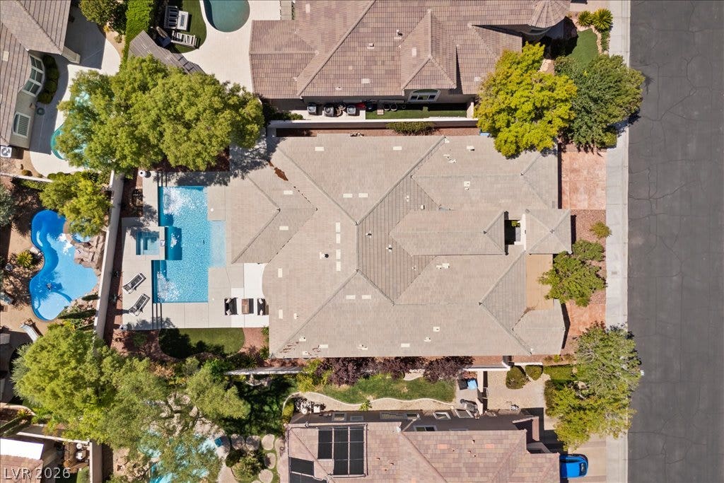 9425 Garnet Crown Avenue, Las Vegas, NV 89145 An aerial perspective showcases the extensive tile roofline and private backyard pool oasis.
