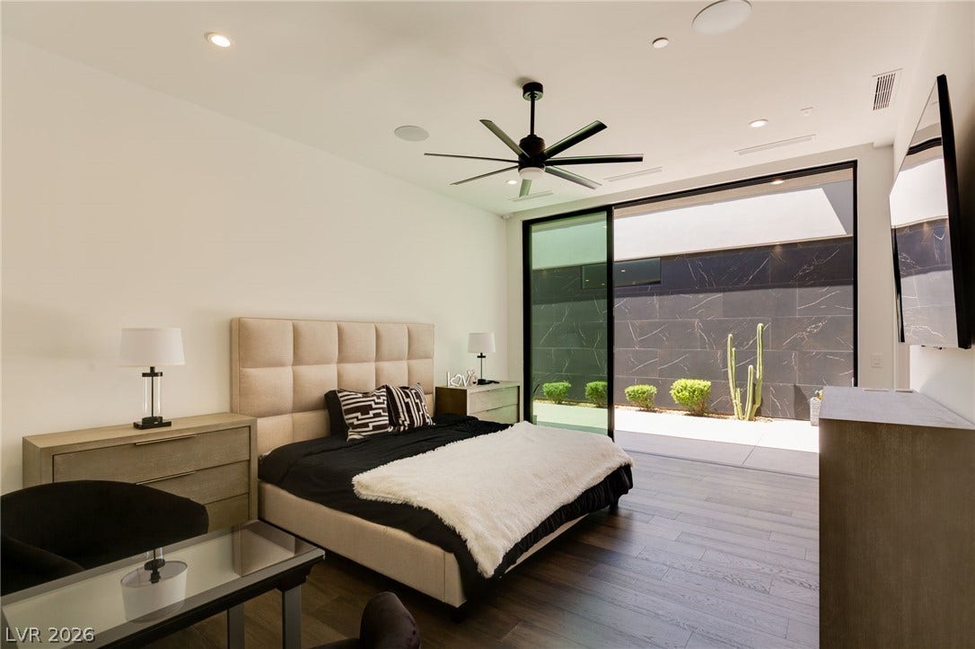 4 Chisel Crest Court, Henderson, NV 89012 Hardwood floors and massive sliding glass doors create a seamless indoor-outdoor connection.