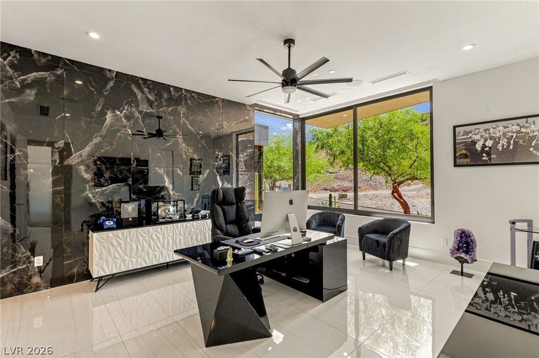 4 Chisel Crest Court, Henderson, NV 89012 Polished tile flooring and large picture windows define this light-filled work environment.