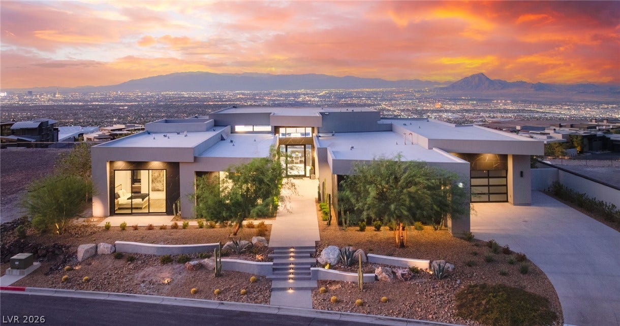 4 Chisel Crest Court, Henderson, NV 89012 Striking contemporary architecture frames sweeping valley and mountain views under a dramatic desert sunset.