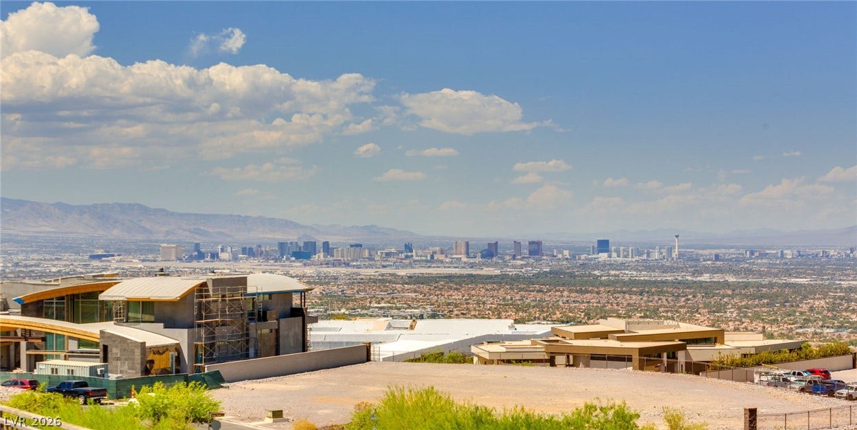 4 Chisel Crest Court, Henderson, NV 89012 Panoramas of the distant city skyline unfold from this elevated hillside vantage point.