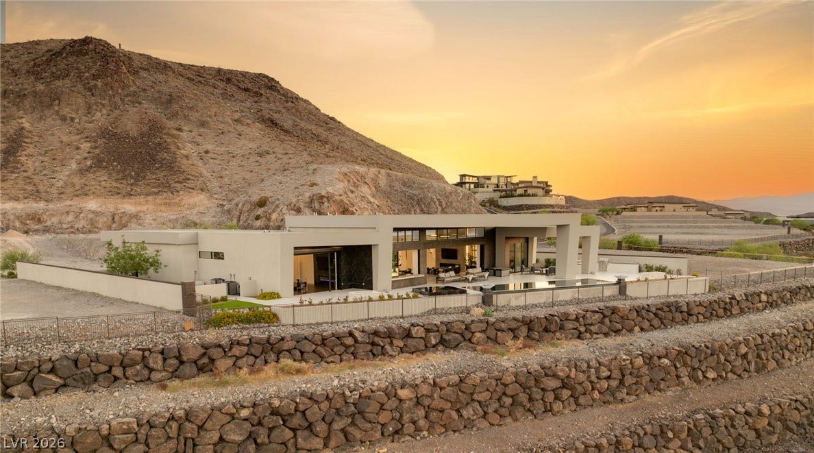 4 Chisel Crest Court, Henderson, NV 89012 Dramatic mountain backdrops frame this sleek, modern estate showcasing clean architectural lines.