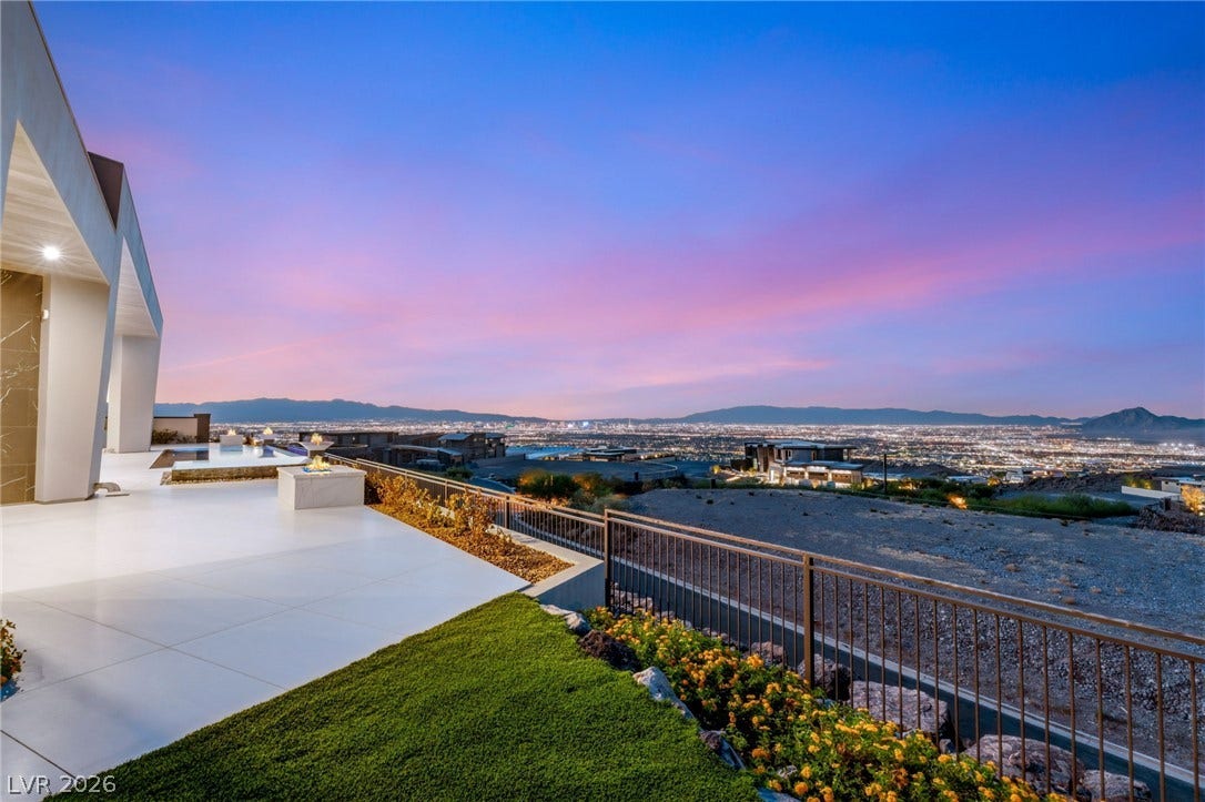 4 Chisel Crest Court, Henderson, NV 89012 Panoramic city lights and mountain vistas unfold from this modern elevated terrace.