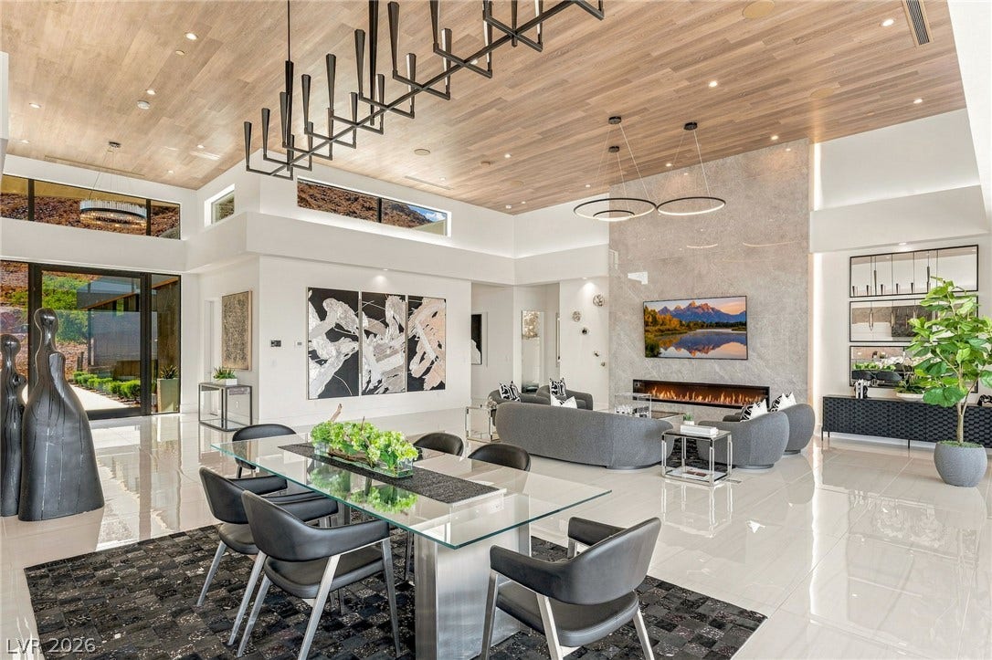4 Chisel Crest Court, Henderson, NV 89012 Polished tile flooring and an elegant wood ceiling enrich this open dining and living space.