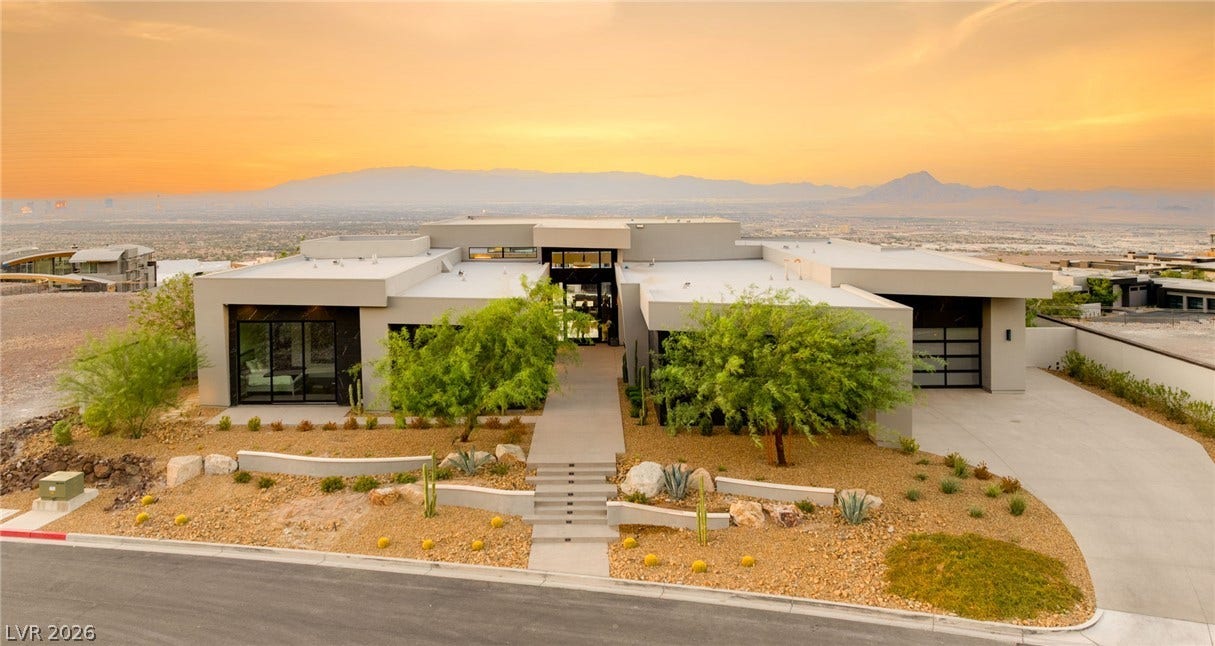 4 Chisel Crest Court, Henderson, NV 89012 Bold contemporary architecture commands attention against a sweeping backdrop of desert and distant mountains.