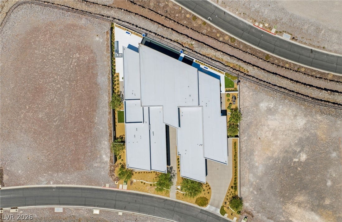 4 Chisel Crest Court, Henderson, NV 89012 An aerial perspective showcases the striking geometric rooflines and modern architectural layout of the property.