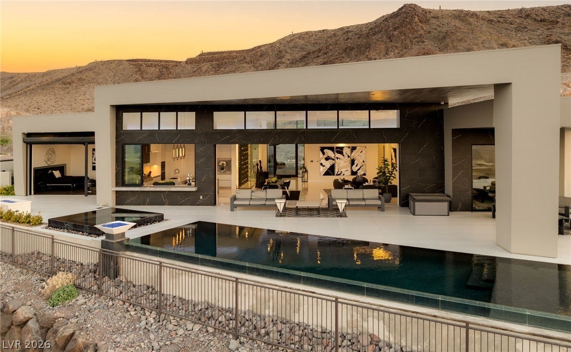 4 Chisel Crest Court, Henderson, NV 89012 Clean architectural lines frame a sleek infinity pool overlooking dramatic desert mountainsides.