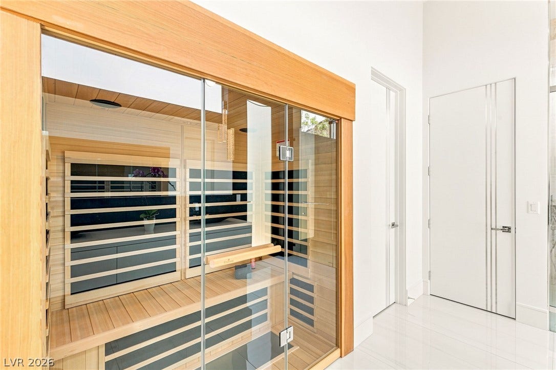 4 Chisel Crest Court, Henderson, NV 89012 An integrated wooden home sauna stands adjacent to sleek minimalist interior doors.