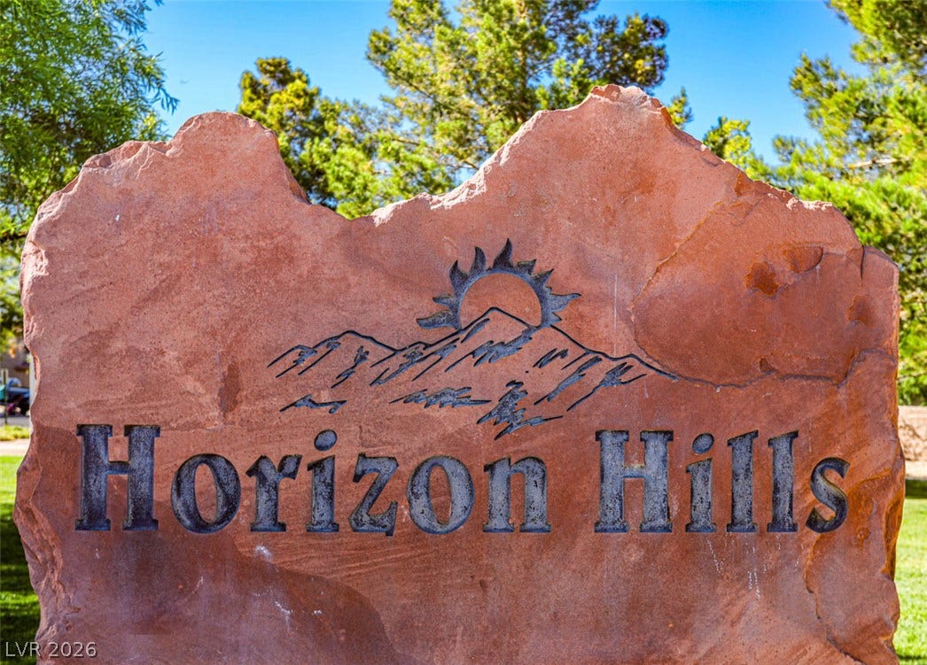 A natural stone monument marks the entrance to a desirable community.