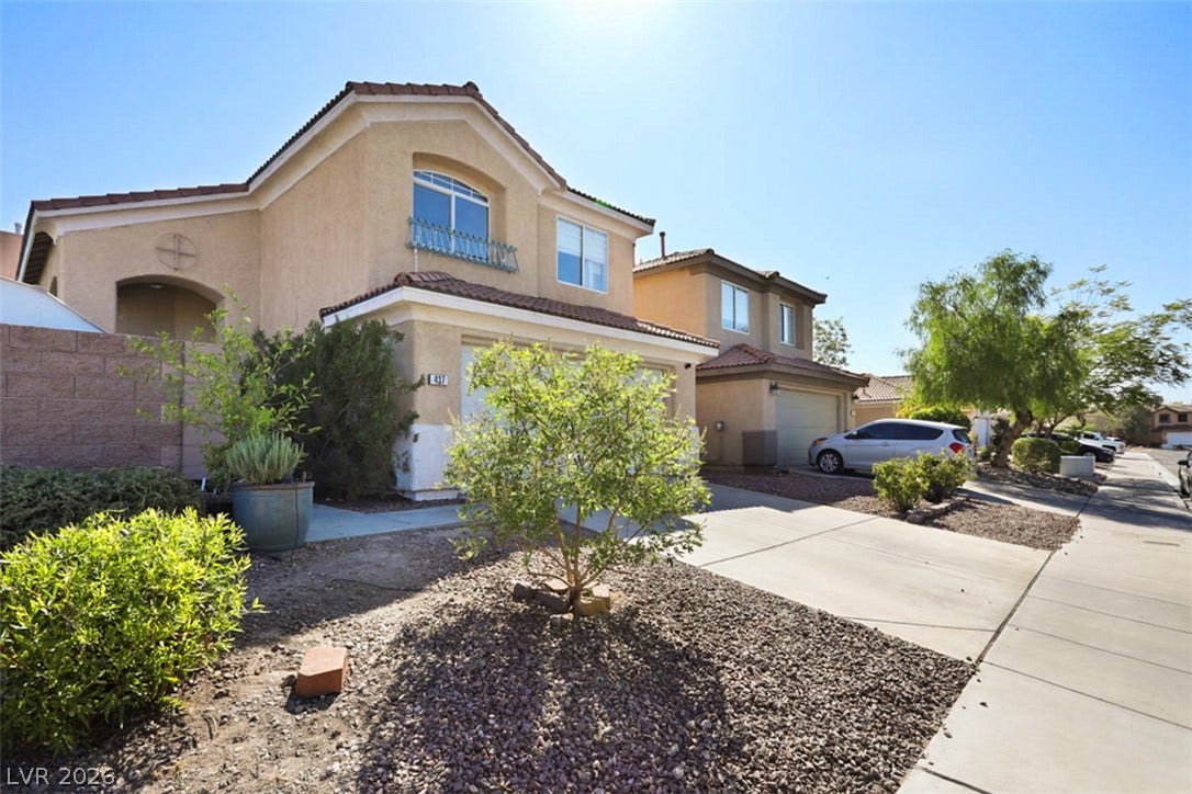 A well-maintained suburban residence offers inviting curb appeal and generous parking.