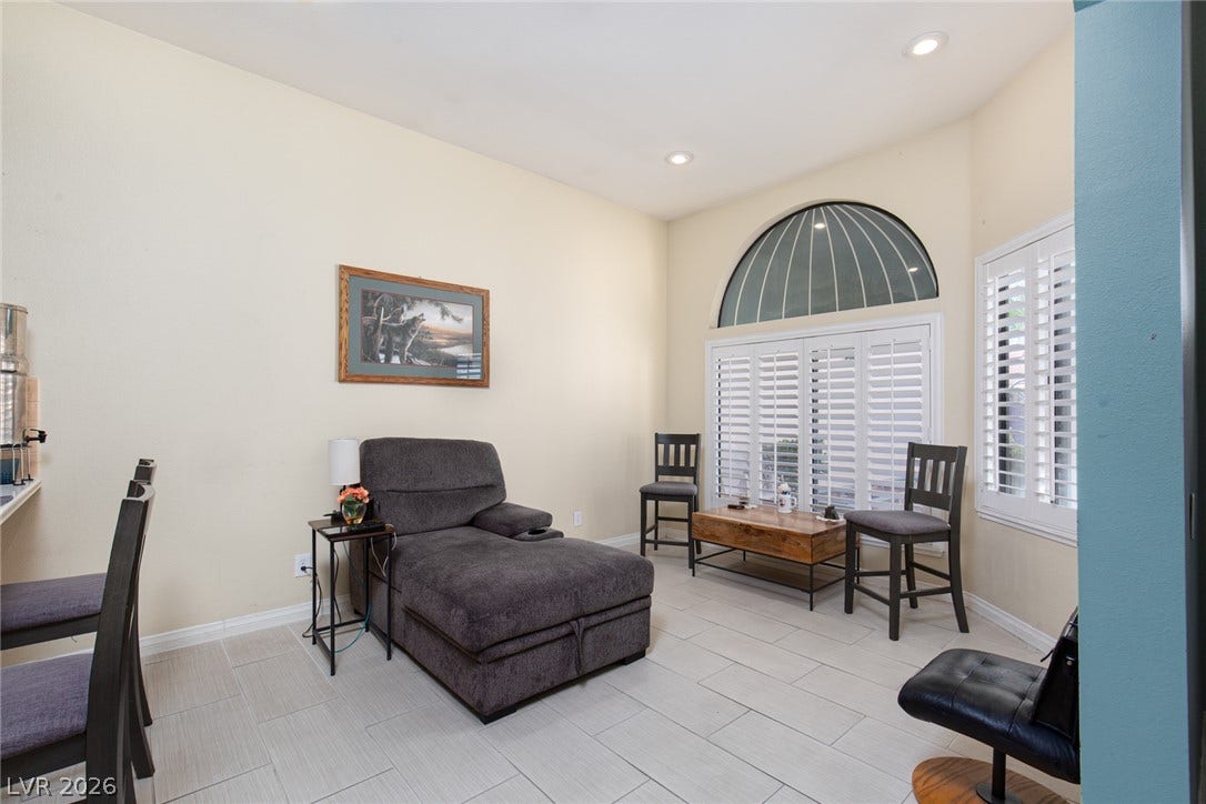 2882 Bridgepointe Drive, Las Vegas, NV 89121 High ceilings and clean tile flooring define this versatile living area with plantation shutters.
